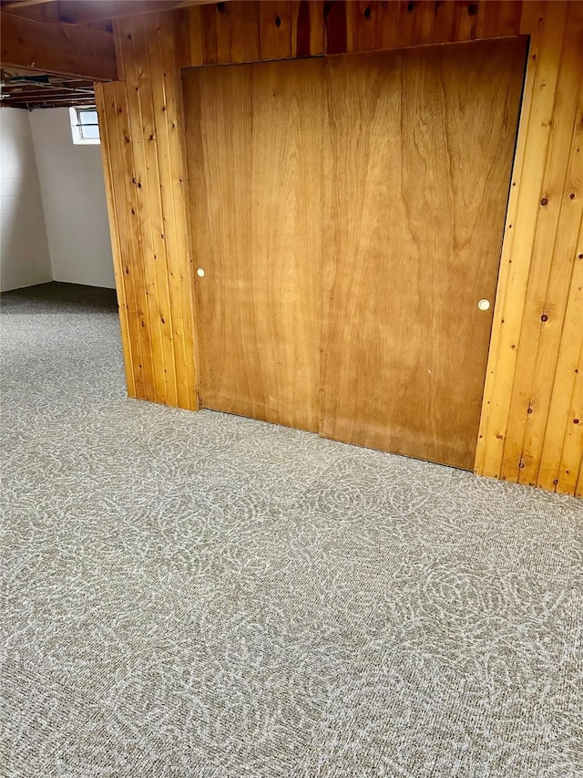 2327 Glenbrook Dr, Des Moines, IA 50316 - below grade area with carpet and wood walls