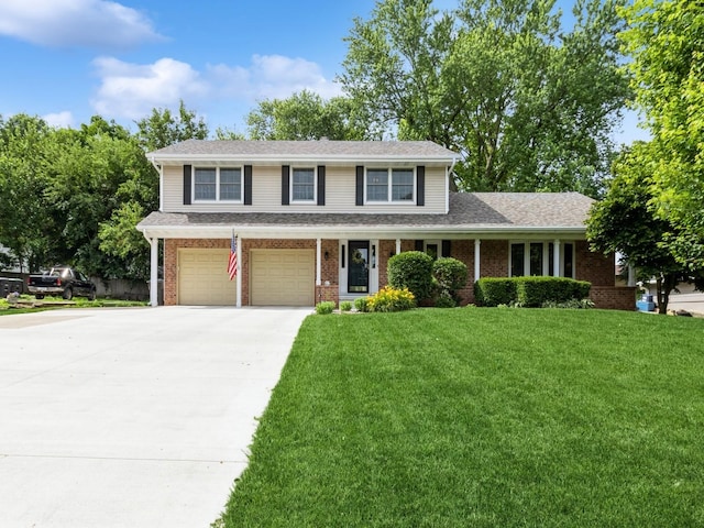 2906 Watrous Ave, Des Moines, IA 50321 - traditional home with concrete driveway, a garage, brick siding, a front lawn, and a shingled roof