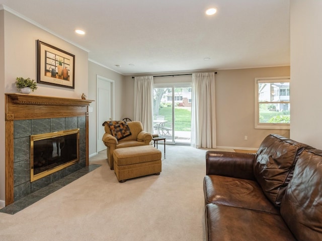 2906 Watrous Ave, Des Moines, IA 50321 - carpeted living room with crown molding, a fireplace, and recessed lighting
