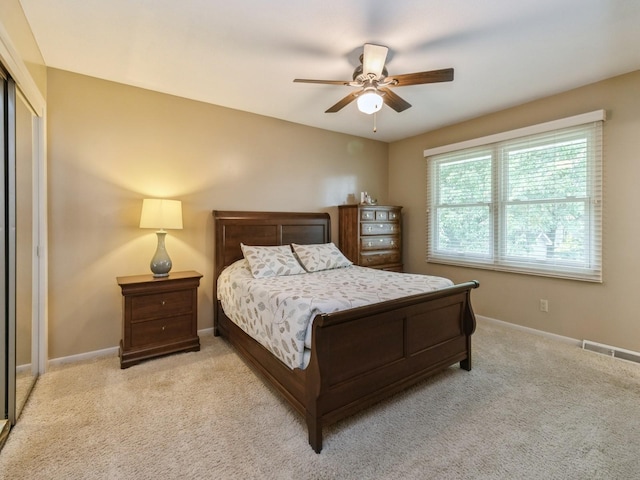 2906 Watrous Ave, Des Moines, IA 50321 - bedroom featuring carpet floors, ceiling fan, and a closet