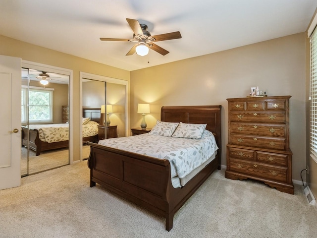 2906 Watrous Ave, Des Moines, IA 50321 - bedroom with carpet, two closets, and ceiling fan
