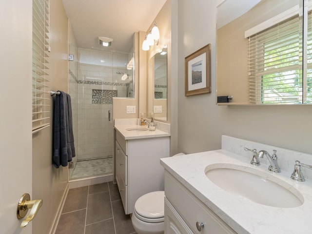 2906 Watrous Ave, Des Moines, IA 50321 - bathroom featuring a stall shower, tile patterned flooring, and vanity