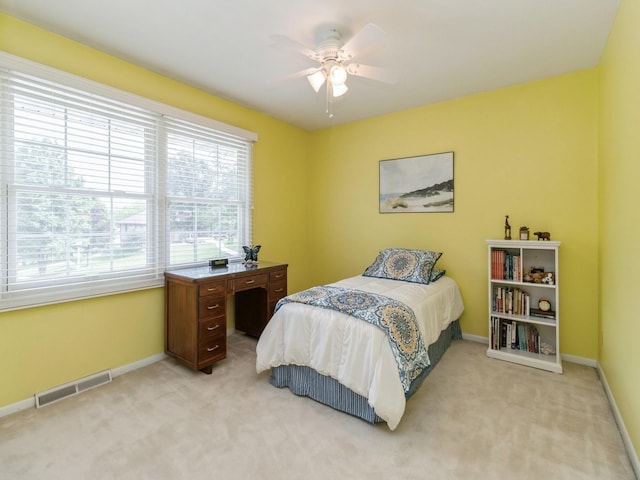 2906 Watrous Ave, Des Moines, IA 50321 - bedroom with light carpet and ceiling fan