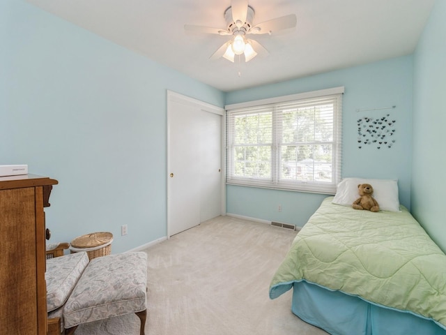 2906 Watrous Ave, Des Moines, IA 50321 - bedroom with carpet, ceiling fan, and a closet