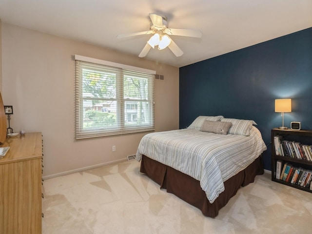 2906 Watrous Ave, Des Moines, IA 50321 - carpeted bedroom featuring baseboards and a ceiling fan