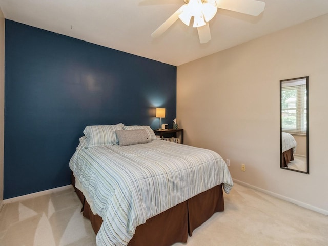 2906 Watrous Ave, Des Moines, IA 50321 - carpeted bedroom with baseboards and a ceiling fan
