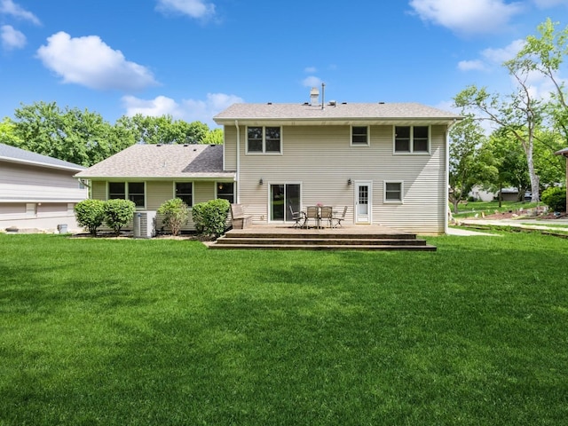 2906 Watrous Ave, Des Moines, IA 50321 - rear view of property with a deck and a lawn