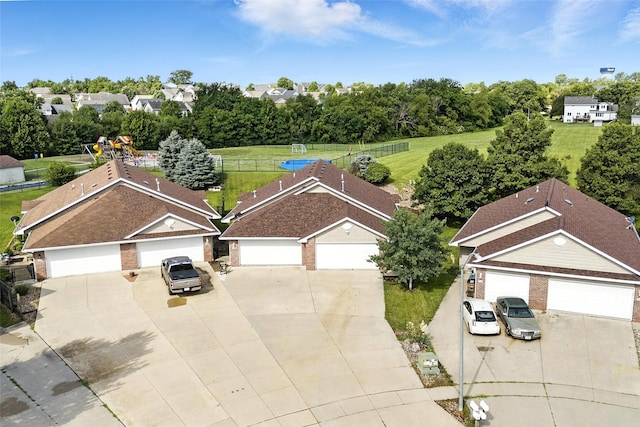 711 Kitterman Cir, Norwalk, IA 50211 - aerial perspective of suburban area with a tree filled landscape