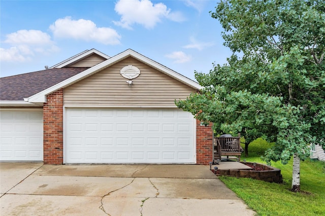 711 Kitterman Cir, Norwalk, IA 50211 - view of front of house with brick siding, roof with shingles, and concrete driveway