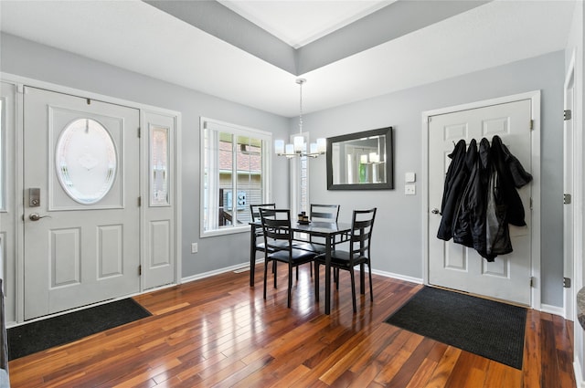 711 Kitterman Cir, Norwalk, IA 50211 - entryway with a chandelier and dark wood-style flooring