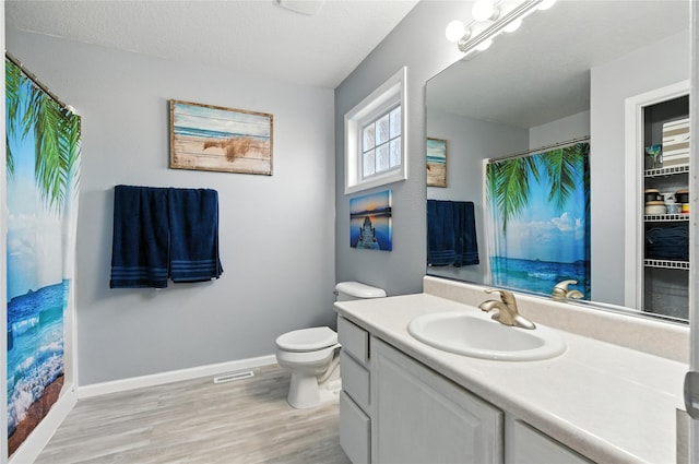 711 Kitterman Cir, Norwalk, IA 50211 - bathroom featuring vanity, wood finished floors, and a shower with shower curtain