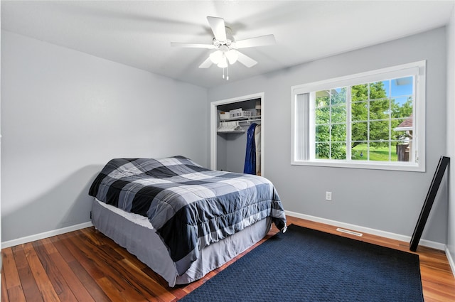 711 Kitterman Cir, Norwalk, IA 50211 - bedroom with wood finished floors, a closet, and a ceiling fan