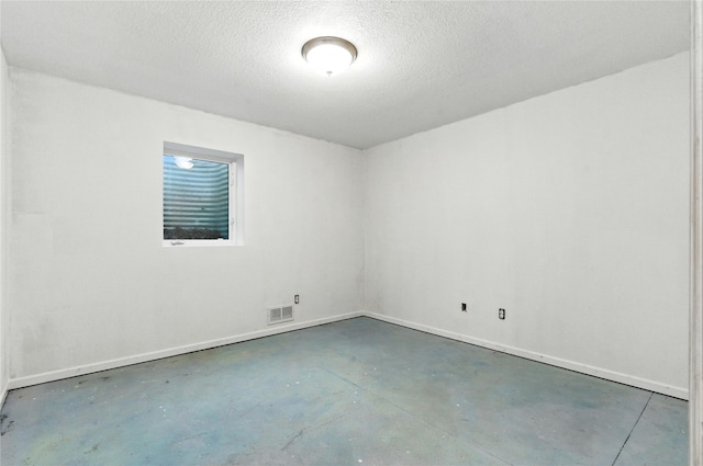 711 Kitterman Cir, Norwalk, IA 50211 - unfurnished room featuring finished concrete flooring and a textured ceiling