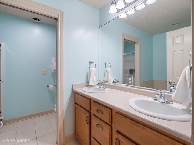 4710 76th St, Urbandale, IA 50322 - full bathroom featuring double vanity and tile patterned flooring