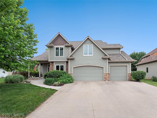 4710 76th St, Urbandale, IA 50322 - craftsman-style house with driveway, an attached garage, a front lawn, roof with shingles, and stone siding