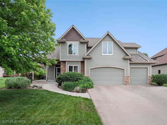 4710 76th St, Urbandale, IA 50322 - craftsman inspired home with concrete driveway, a garage, a front lawn, and a shingled roof