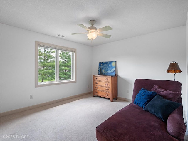 4710 76th St, Urbandale, IA 50322 - living area featuring carpet floors and ceiling fan