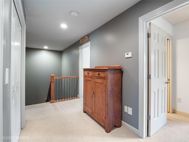 4710 76th St, Urbandale, IA 50322 - corridor featuring an upstairs landing, light colored carpet, and recessed lighting