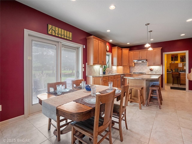 4710 76th St, Urbandale, IA 50322 - dining room with light tile patterned floors and recessed lighting