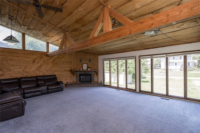 600 S 3rd Ave W, Newton, IA 50208 - unfurnished living room with carpet flooring, wood walls, wood ceiling, ceiling fan, and a fireplace