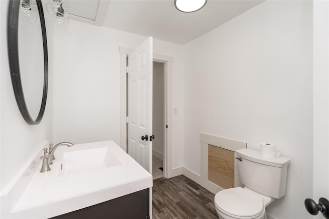 600 S 3rd Ave W, Newton, IA 50208 - half bathroom featuring vanity and wood finished floors