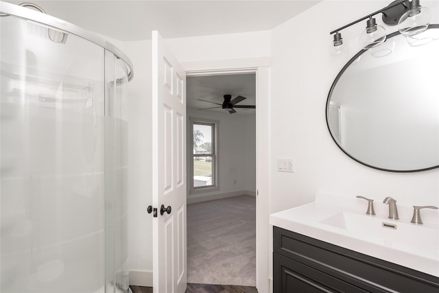 600 S 3rd Ave W, Newton, IA 50208 - full bathroom featuring a stall shower, vanity, and a ceiling fan