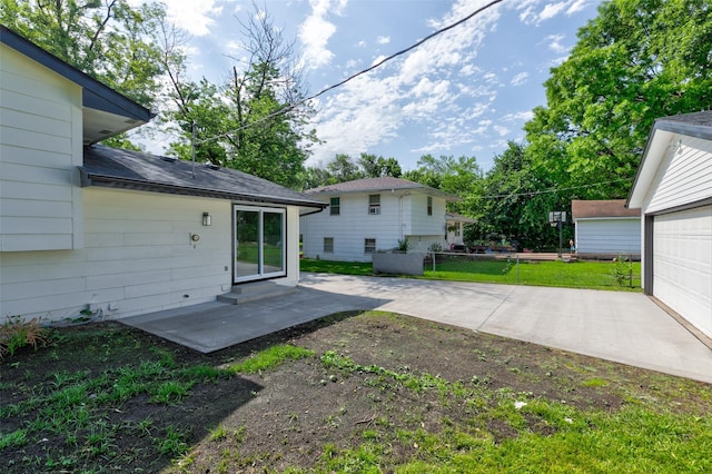 4132 E 24th Ct, Des Moines, IA 50317 - view of yard with a patio and a garage