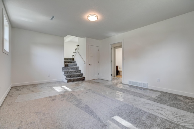 4132 E 24th Ct, Des Moines, IA 50317 - empty room featuring carpet flooring and stairway
