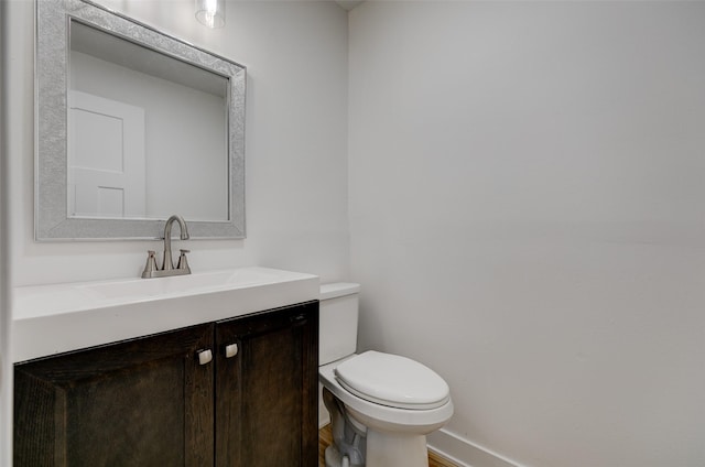 4132 E 24th Ct, Des Moines, IA 50317 - half bath featuring vanity and toilet