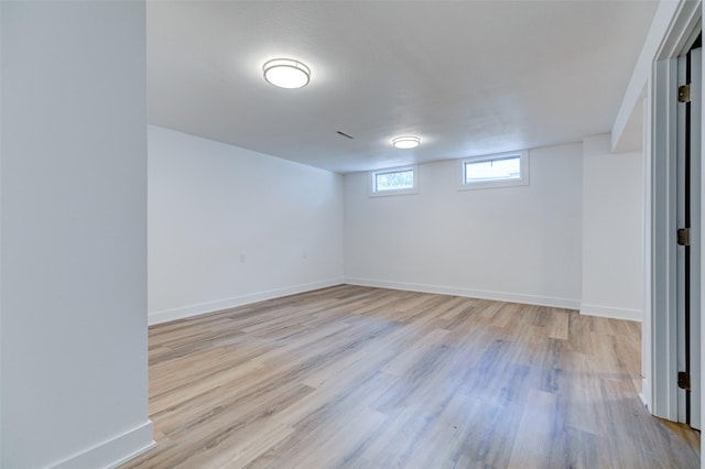 4132 E 24th Ct, Des Moines, IA 50317 - basement featuring light wood-type flooring and baseboards