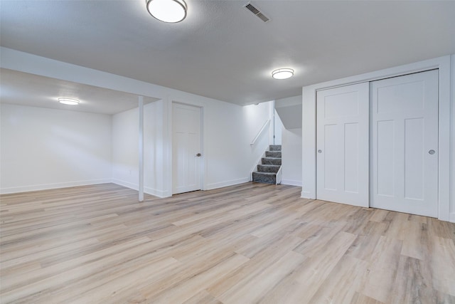 4132 E 24th Ct, Des Moines, IA 50317 - finished below grade area with light wood-style floors and stairway