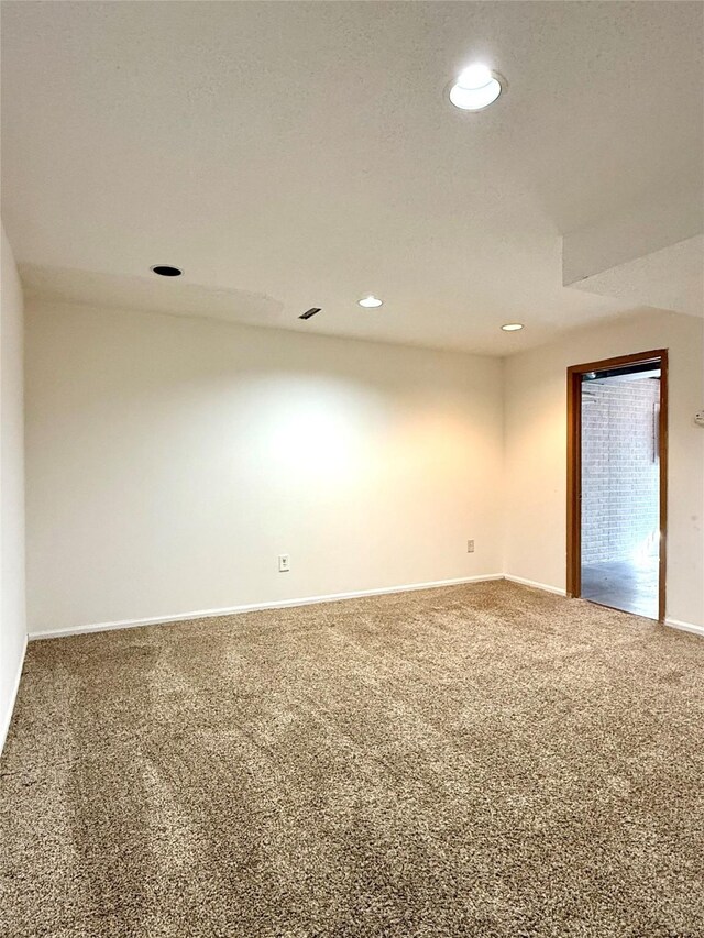 2519 W 1st St, Ankeny, IA 50023 - empty room featuring carpet flooring and recessed lighting