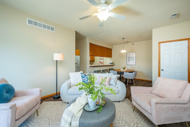 8601 Westown Pkwy Unit 18211, West Des Moines, IA 50266 - living room featuring light wood-style floors and a ceiling fan