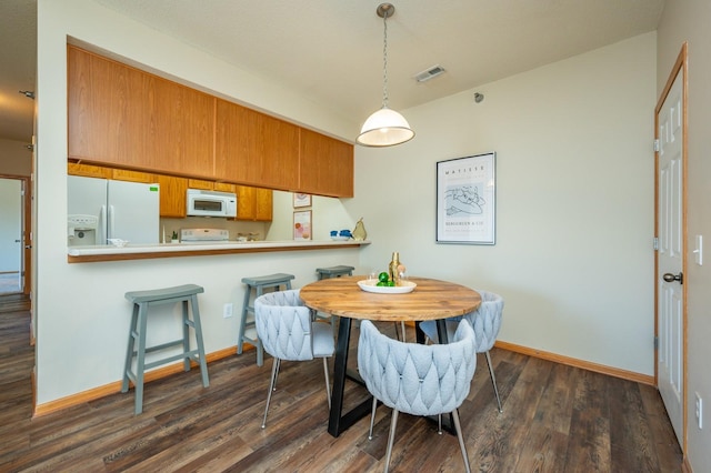 8601 Westown Pkwy Unit 18211, West Des Moines, IA 50266 - dining room with dark wood-style flooring and baseboards