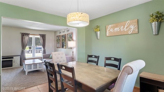 608 E 15th St N, Newton, IA 50208 - dining room featuring carpet and tile patterned floors