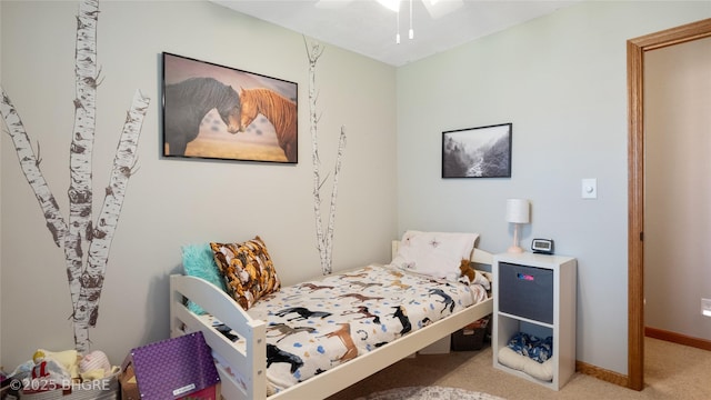 608 E 15th St N, Newton, IA 50208 - carpeted bedroom with baseboards and a ceiling fan