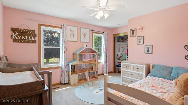 608 E 15th St N, Newton, IA 50208 - carpeted bedroom with baseboards and a ceiling fan