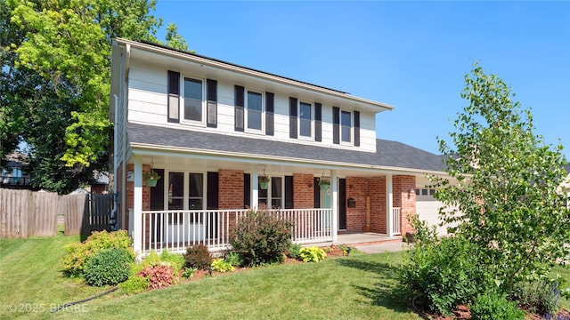 608 E 15th St N, Newton, IA 50208 - traditional home featuring brick siding, covered porch, and a garage