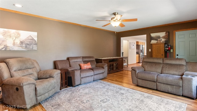 608 E 15th St N, Newton, IA 50208 - living area with wood finished floors, a ceiling fan, and ornamental molding