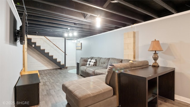 608 E 15th St N, Newton, IA 50208 - living room featuring wood finished floors and stairway