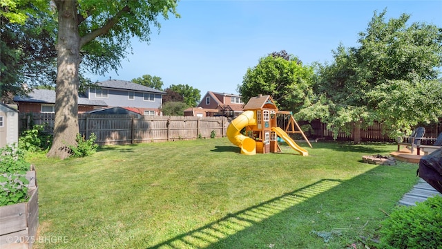 608 E 15th St N, Newton, IA 50208 - fenced backyard featuring a playground