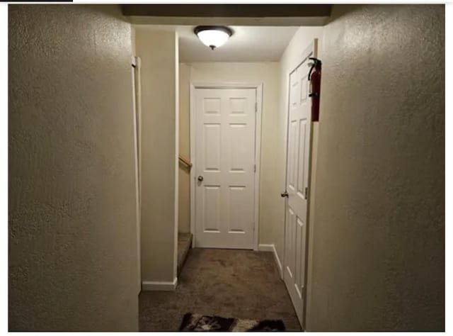 1096 Buchanan St, Des Moines, IA 50316 - hall with dark colored carpet and baseboards