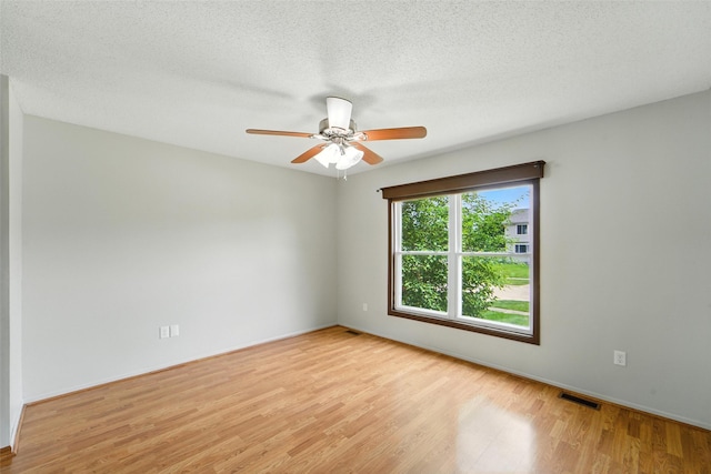 1228 64th St, West Des Moines, IA 50266 - unfurnished room featuring wood finished floors and a ceiling fan