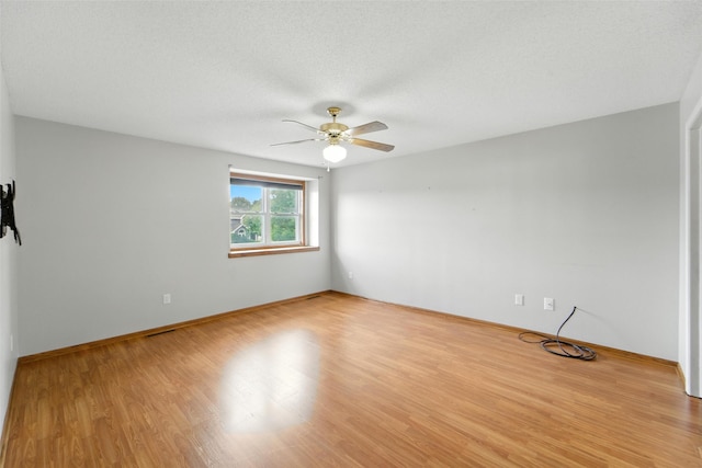 1228 64th St, West Des Moines, IA 50266 - spare room featuring a ceiling fan and light wood-type flooring