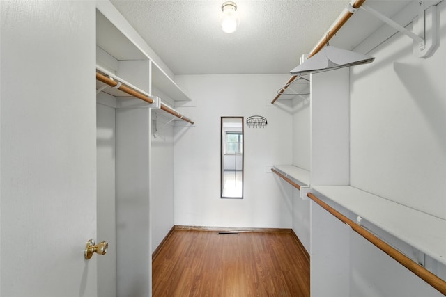 1228 64th St, West Des Moines, IA 50266 - spacious closet featuring light wood finished floors