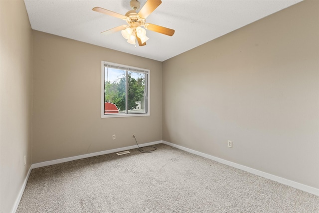 1913 E Bell Ave, Des Moines, IA 50320 - empty room with carpet floors and a ceiling fan