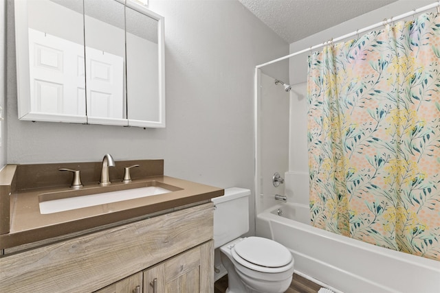 1913 E Bell Ave, Des Moines, IA 50320 - bathroom with vanity, a textured ceiling, and shower / tub combo with curtain