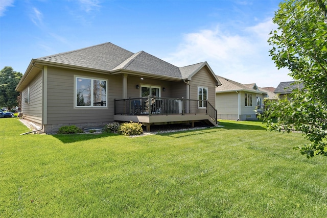 4315 129th St, Urbandale, IA 50323 - back of house with a wooden deck, a lawn, and roof with shingles