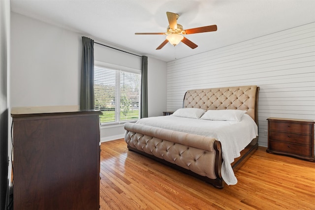 4315 129th St, Urbandale, IA 50323 - bedroom with light wood finished floors and a ceiling fan