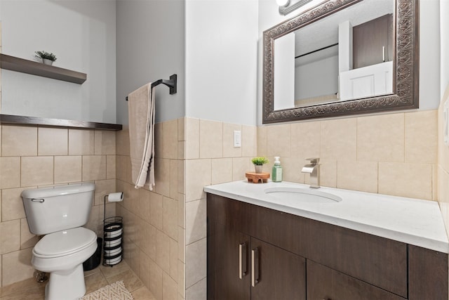 4315 129th St, Urbandale, IA 50323 - bathroom with tile walls, vanity, and a wainscoted wall
